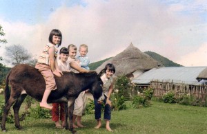 Jane in Ethiopia as a child. Jane is in front of the donkey. 